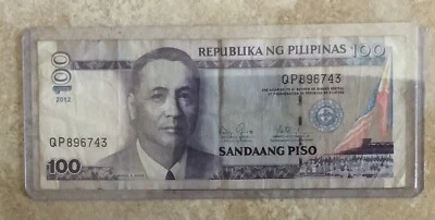 Philippines 100 Piso (2012) - President Roxas/Central Bank Building - Image 1 of 2