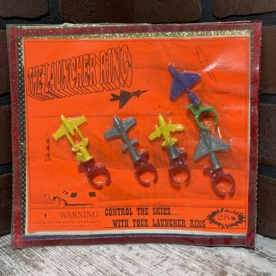 Vintage Vending Machine Launcher Air Plane Rings On Display Card SEALED RARE - Image 1 of 4