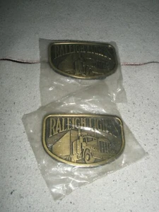 2 RALEIGH LIGHTS brass belt buckles w/ Semi Truck 1980's  NEW in Bags - Picture 1 of 9
