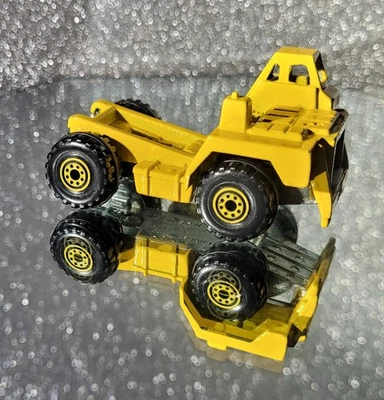 Camión de volteo Hot Wheels 1979 fundido a presión Cat Caterpillar amarillo Foto 1 de 4