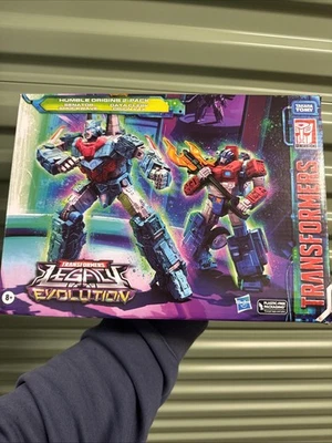 ТРАНСФОРМЕРЫ НАСЛЕДИЕ - СКРОМНОЕ ПРОИСХОЖДЕНИЕ УПАКОВКА 2 ШТ. - СЕНАТОР SHOCKWAVE & ORION PAX - Изображение 1 из 4