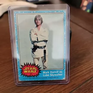 1977 Topps Star Wars Blue Series Card #57, Mark Hamill as Luke Skywalker - Picture 1 of 6