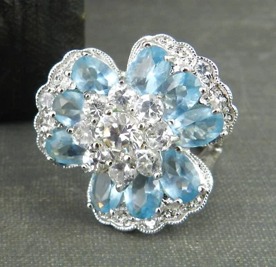 Anillo Flor Racimo Cristal Azul y Transparente Tono Plata Firmado Nolan Miller Foto 1 de 4
