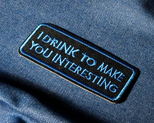 I Drink To Make You Interesting Iron-On Patch – 9 x 4cm Funny Blue & Black - Picture 1 of 4