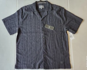 Camisa polo negra en relieve Saints Studio para hombre - Talla: mediana - Imagen 1 de 22