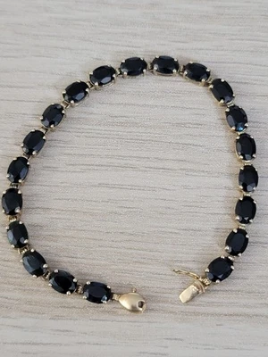 Brazalete de piedras preciosas azul oscuro de oro amarillo macizo de 14k Foto 1 de 4