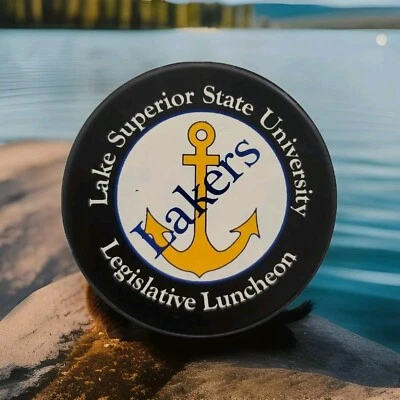 LAKE SUPERIOR STATE UNIVERSITY LAKERS LEGISLATIVE LUNCHEON NCAA HOCKEY PUCK - Image 1 of 4