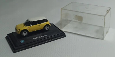 REAL-X MINI COOPER YELLOW 1:72 DIECAST MINI TOY CAR w/ WRONG BASE & CASE - Image 1 of 4