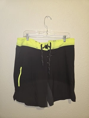 Boardshorts OPFlex Ocean Pacific 34 para hombre negro amarillo neón elástico en 4 vías Foto 1 de 4