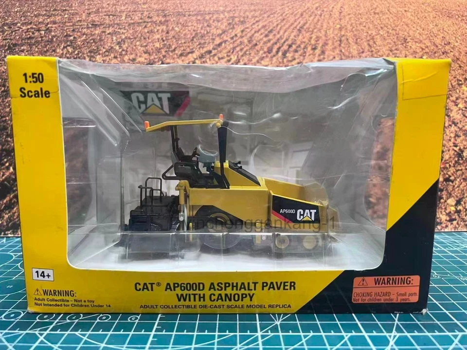 1:50 Norscot Caterpillar Cat AP600D Asphalt Paver  Scale DieCast Model 55259 - Image 1 of 4