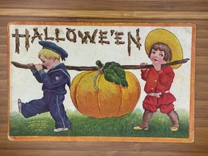 Embossed Halloween Postcard Boy in Sailor Suit and Girl Carrying Giant Pumpki - Picture 1 of 2