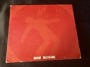 CD: GREENDAY ""BULLET IN A BIBBLE"" 2005 2 DISCOS UN CD Y UN DVD CARTÓN ROCK - Imagen 1 de 6