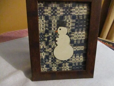 ANTIQUE FRAMED COVERLET PIECE WITH WOODEN SNOWMAN--FRAME 8 1/2"X6 1/2" - Image 1 of 3