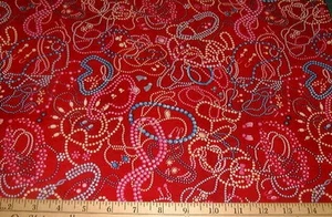 Tela FABRI-COLCHA - 50+ - Collares lanzados en rojo - 18" / CORTE MEDIA YARDA - Imagen 1 de 1