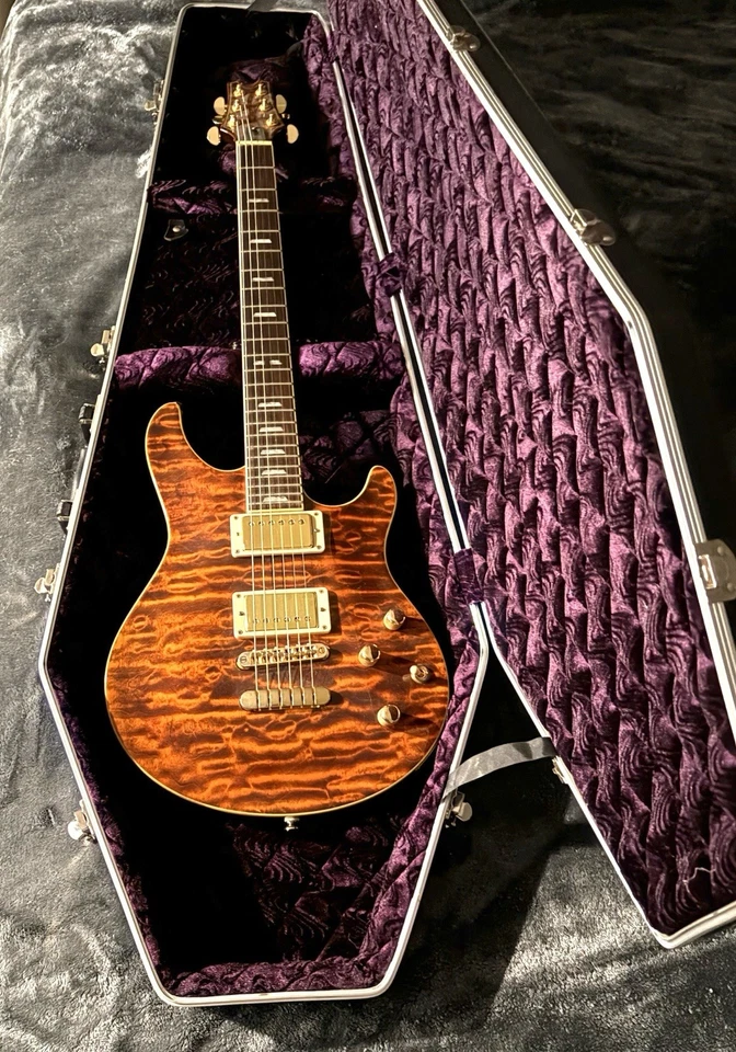 Guitarra Eléctrica Peavy HP Signature Serie EXP Acabado Ojo de Tigre Foto 1 de 2