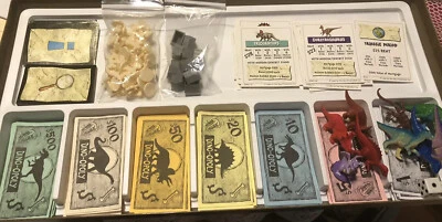 Dinosaur Monopoly DinoOpoly Juego de Mesa Late for the Sky Triceratops Stegosaurus Foto 1 de 4