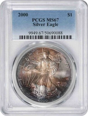 2000 $1 American Silver Eagle MS67 PCGS Toned Tan w/ Purple and Steel Blue - Image 1 of 2
