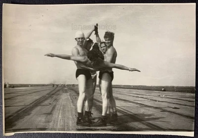 Runway Beach Sports Joke Plane Handsome men trunks muscle bulge photo Gay Int - Image 1 of 4