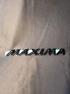 NEW 2000-2001 Nissan Maxima OEM Trunk Lid Emblem Badge Logo Black 84894-2Y906 - Picture 1 of 12