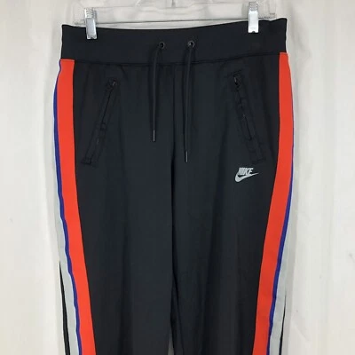 Pantalones deportivos Nike a rayas negros al tobillo dividido bolsillos con cremallera AT5476-010 medianos Foto 1 de 4