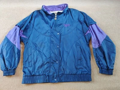 Chaqueta cortavientos Reebok de colección para adultos pequeña cremallera completa botón a presión azul púrpura Foto 1 de 4