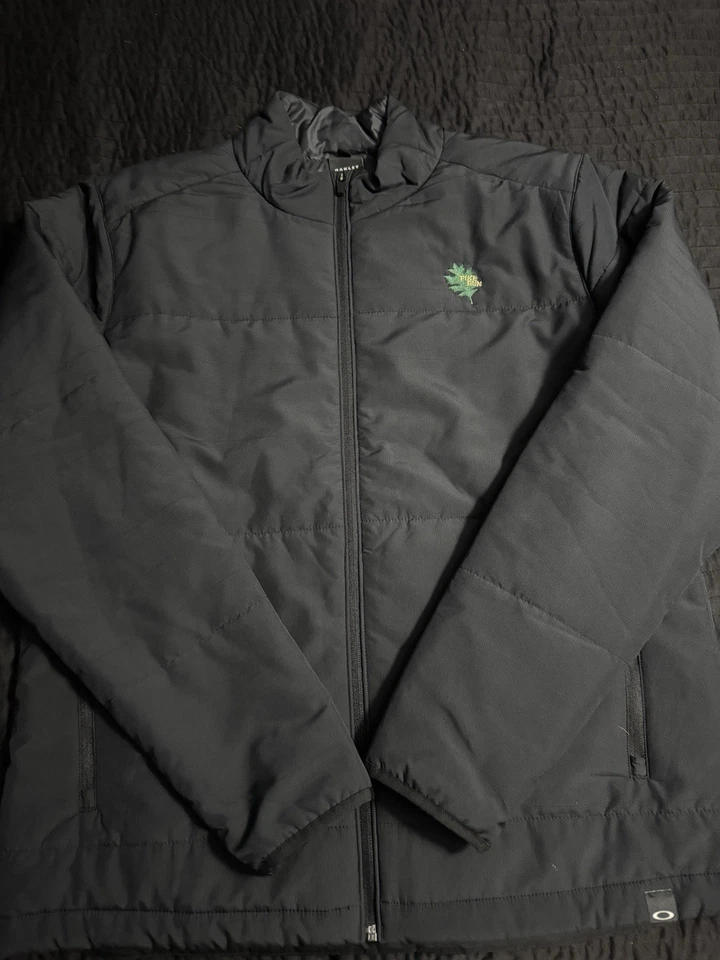 Chaqueta acolchada ligera con cremallera completa aislada Oakley para hombre XL personalizada negra golf opio Foto 1 de 4