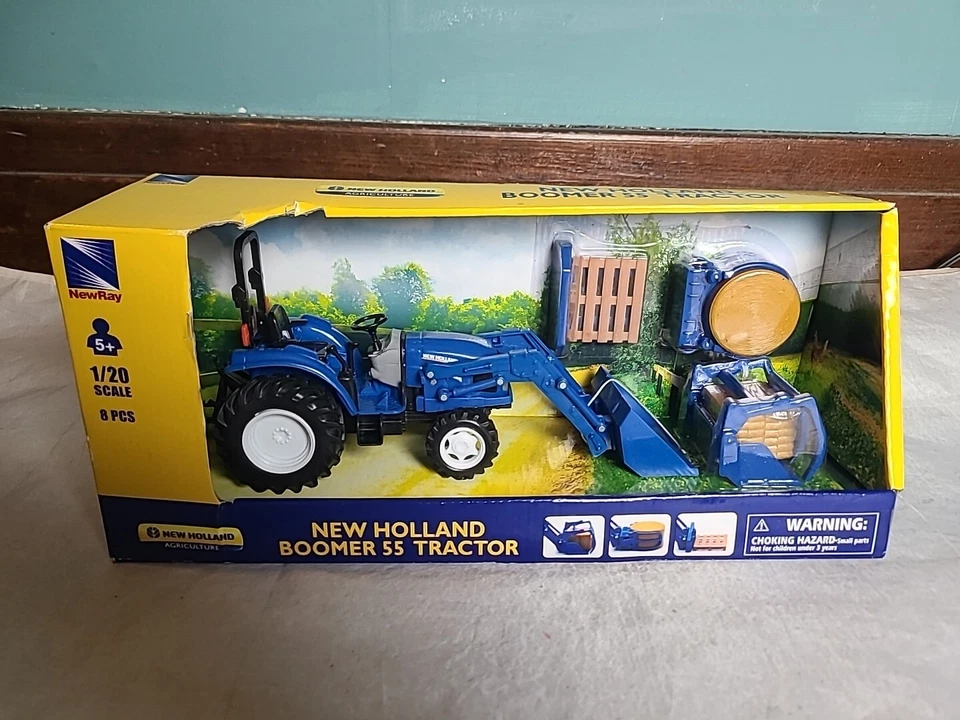 1/20 Scale New Holland Boomer 55 Tractor & Attachments (8pcs) New-Ray SS-05056 - Image 1 of 4