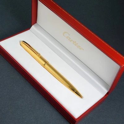 Bolígrafo Must De Cartier enchapado en oro amarillo con caja original Foto 1 de 4