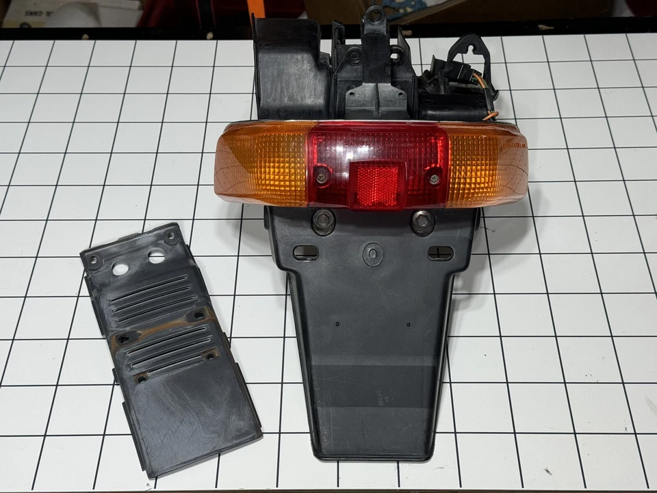 1987 Honda Elite 50 S SE50 P JDM DJ1 Rear Tail Light & Cover Panel Trim Fender - Image 1 of 4