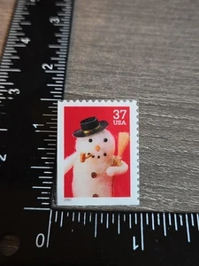 EE. UU. Pin de plástico para estampillas 2002 37¢ muñeco de nieve con sombrero negro Usps Z1 - Imagen 1 de 2
