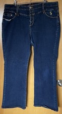 Womens Baby Phat Size 24 Jeans. Good Condition. Pre-Owned. Dark color with gold.