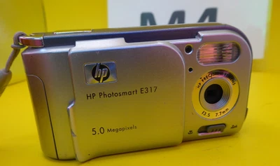 HP Photosmart E317 5.0MP Compact Digital Camera Silver Tested fully takes 2x AA - Image 1 of 4