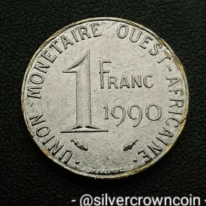 West African States 🇸🇳 🇧🇯 🇧🇫 🇳🇪 1 Franc 1990 (a). KM#8. 1$ coin. Taku. - Picture 1 of 7