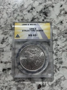 1886 MORGAN SILVER DOLLAR ANACS CERTIFIED MS63! MINT ERROR STRUCK THROUGH DEBRIS - Picture 1 of 3