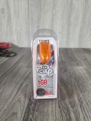 NEW SEALED 2007 Coby MP3 Audio Player 1GB Clip Orange MP-C582 - Image 1 of 4
