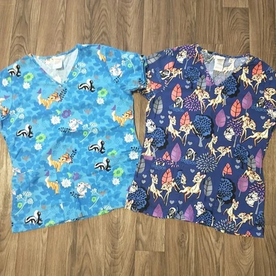 Lot Of 2 Disney Bambi Scrub Tops Women XS Short Sleeves Pockets V Neck Cotton - Image 1 of 4