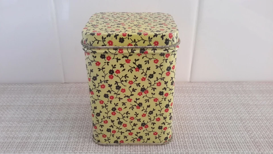 Unmarked  Yellow Metal Tin Storage Container Box Red/Black Flowers 3.75x2.5x2.5" - Image 1 of 4
