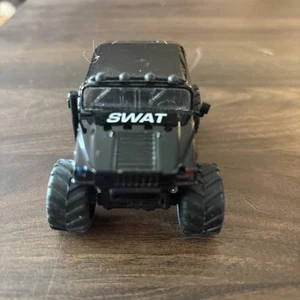JADA Toys 2006 HUMMER H1 POLICE 1:64 BLACK WITH GRAPHIC 68 - Picture 1 of 4