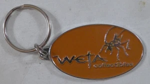 Weta Collectibles Weta Workshop Museum Key Chain Orange Enamel - Picture 1 of 4