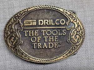 Hebilla de cinturón vintage años 70 DRILCO campo petrolífero HERRAMIENTAS DE HERRERO LATÓN grabado occidental - Imagen 1 de 4