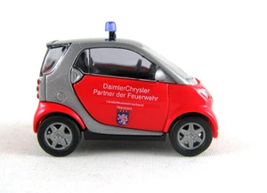 Busch 489307 Smart City Coupe Vigile Del Fuoco Hessen HO 1:87 NUOVO - Foto 1 di 1