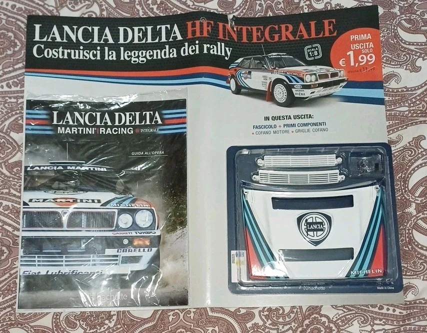 PRIMA USCITA FASCICOLO COMPONENTI LANCIA DELTA HF INTEGRALE HACHETTE SCALA 1:8 - Immagine 1 di 4