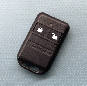 CODE ALARM KEYLESS REMOTE START TRANSMITTER KEY FCC ID: ELVATCG - Picture 1 of 2
