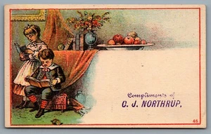 Trade Card c1880s Compliments Card C. J. Northrup Two Children Reading Books - Picture 1 of 3
