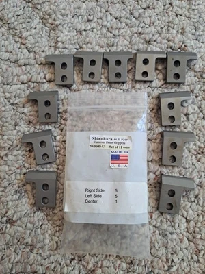 JUEGO DE 11 PINZAS DE TAMBOR DE ROTACIÓN DE PRENSA SHINOHARA SERIE 66 CON ALMOHADILLAS DE URETANO NUEVAS Foto 1 de 4