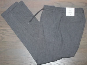 PANTALONES H&M HOMBRE GRIS AJUSTADO PUÑOS CÓNICOS CINTURA ELÁSTICA CORDÓN TALLA S NUEVOS CON ETIQUETAS - Imagen 1 de 4
