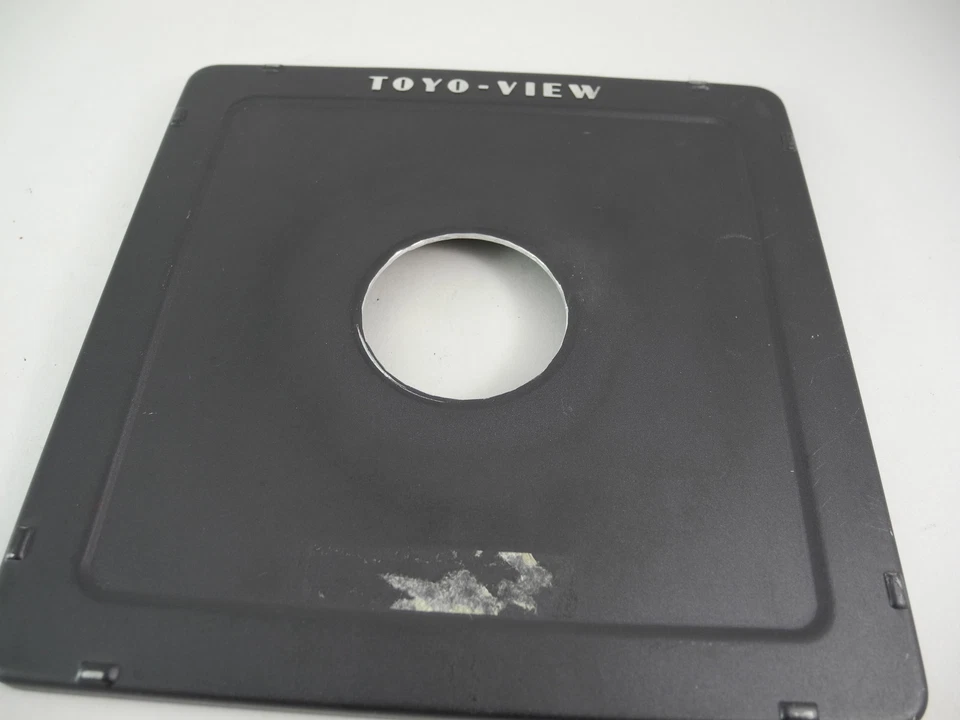 TOYO VIEW LENS BOARD METAL 6x6 WITH 1 9/16th in HOLE PERFECT USABLE TAPE RESIDUE - Image 1 of 4