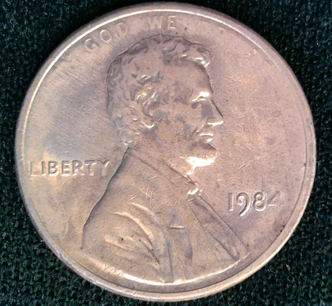 1984p Lincoln cent struck thru grease Cover