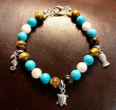 Natural stone. Tigers eye, blue howlite, and moon stone beaded Charm bracelet - Image 1 of 4
