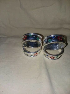 Juego de 4 servilleteros chapados en plata años 80. Con flores y estrellas - Imagen 1 de 3